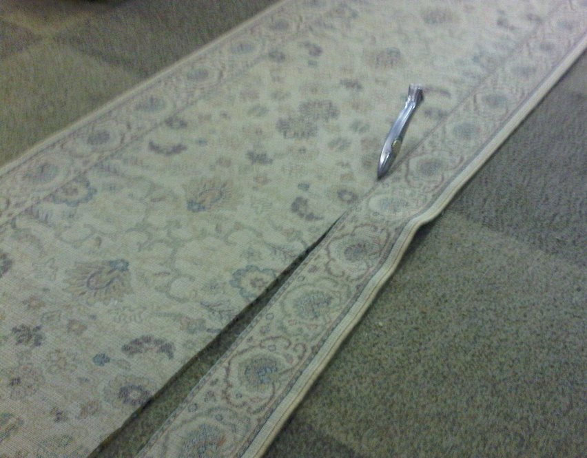 Border from the runner is cut to edge the broadloom 